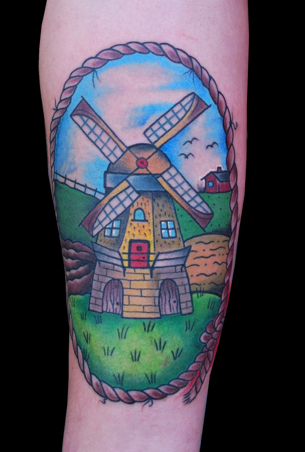 Black and Grey Windmill by Justin Hicks TattooNOW