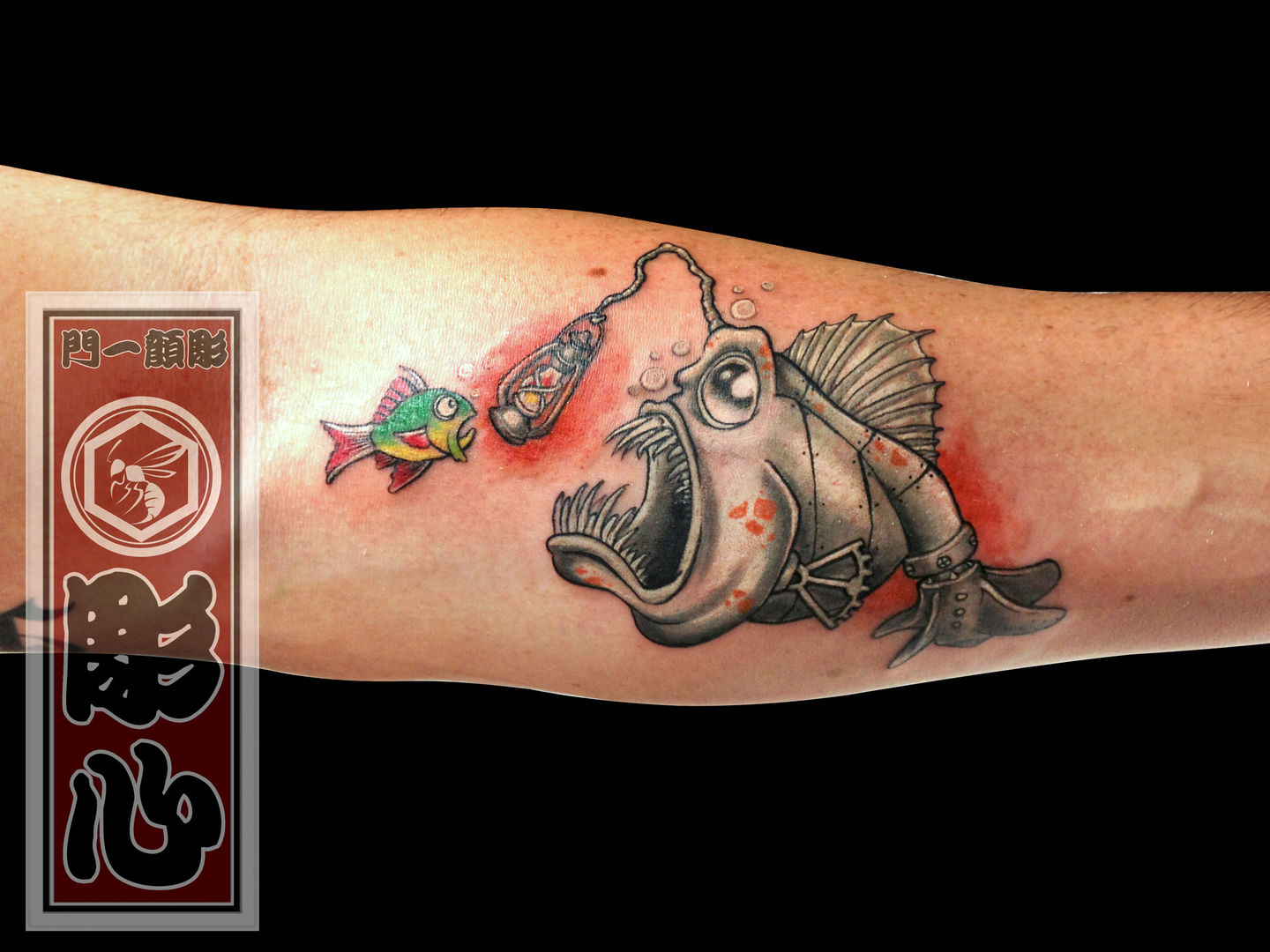 Neotraditional anglerfish tattoo on the thigh.