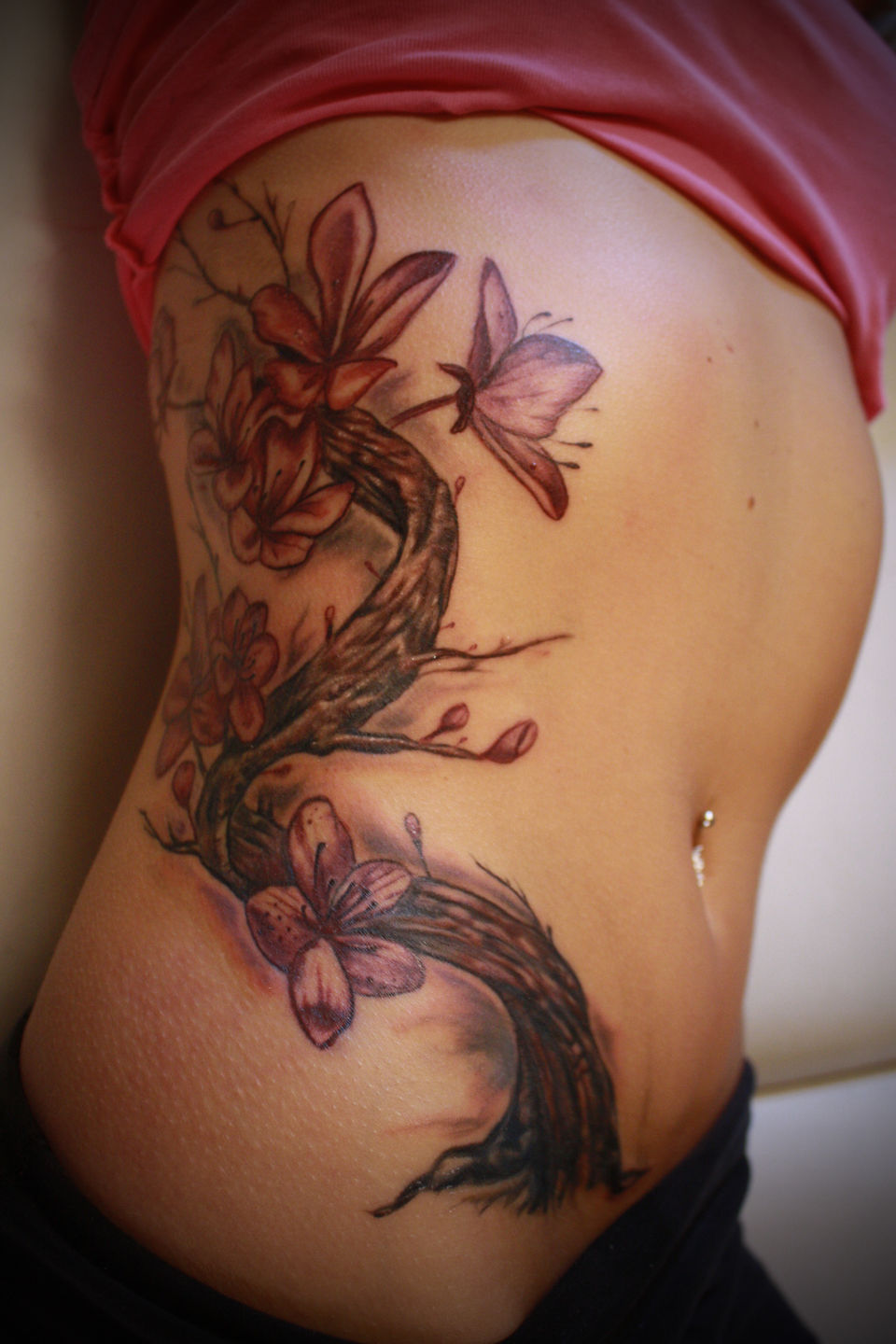 Red Cherry Blossom Tattoo On Side Rib