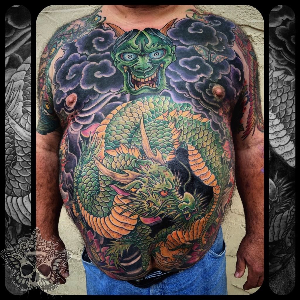 prompthunt: full male torso, heavily tattooed, black and gray surrealism,  dragon theme, highly detailed,