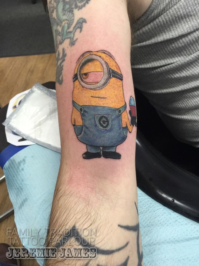 Young girl with minion temporary tattoo transfer on arm and wearing Frozen  top Stock Photo - Alamy