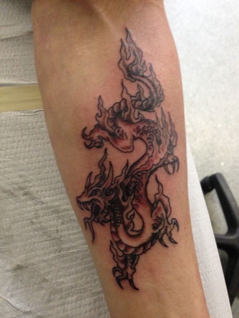 dragon tatoo on her arm