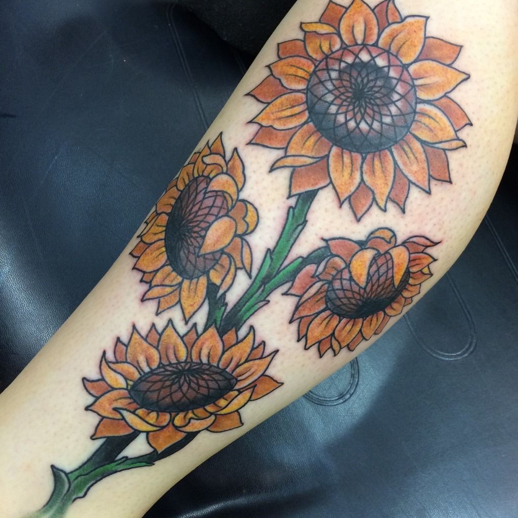 A summery tattoo design of a sunflower on sun kissed skin is a perfect  symbol of joy and fun | Ratta Tattoo