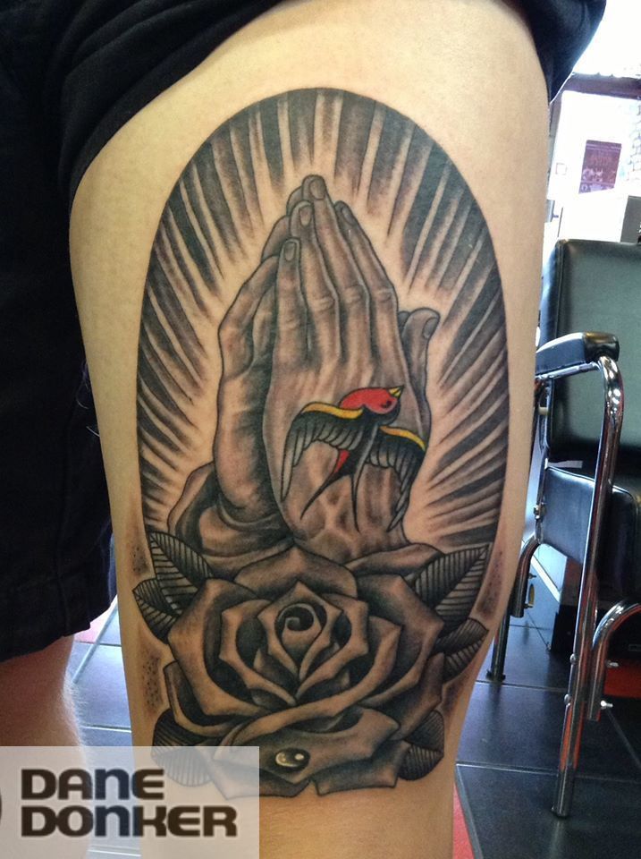 praying hands with rose tattoo