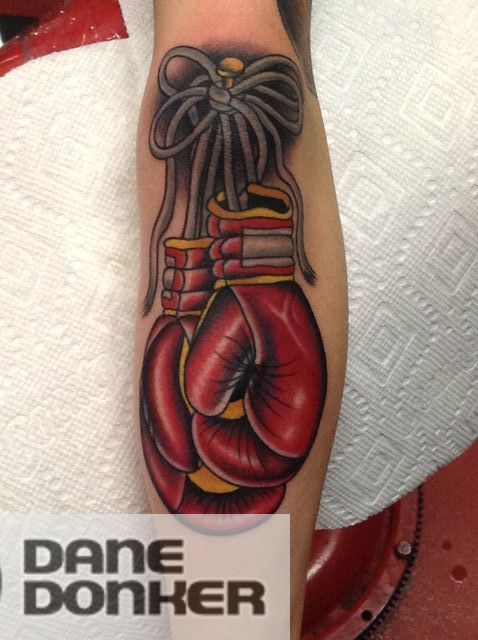 Fine line boxing gloves tattoo located on the inner