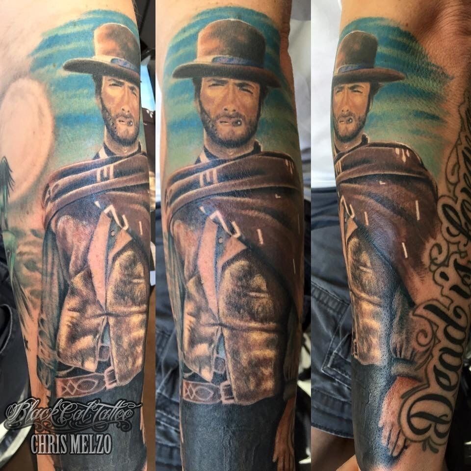 Black and grey Clint Eastwood tattoo on the inner