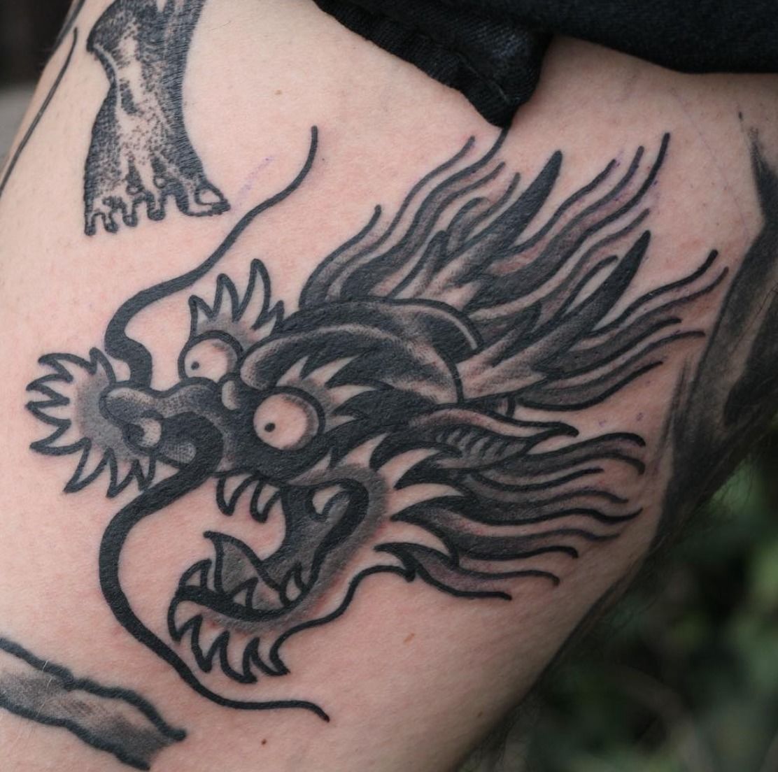 american traditional dragon head tattoo