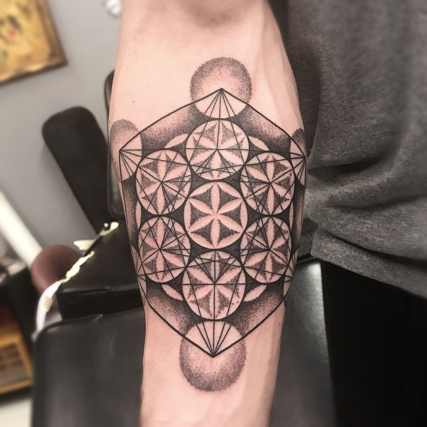 Black and grey Metatrons cube tattoo on leg by Tyler Nolan
