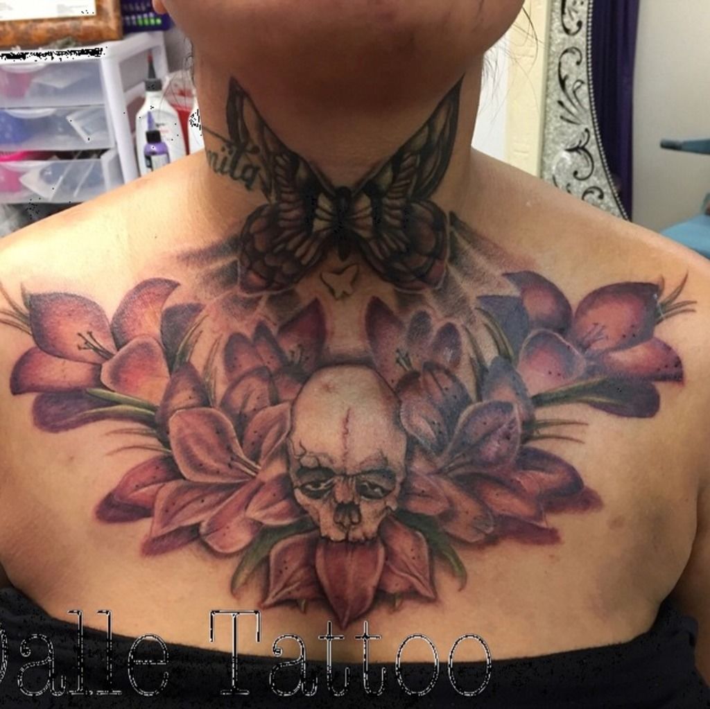 Back of the neck tattoo of a lotus flower.