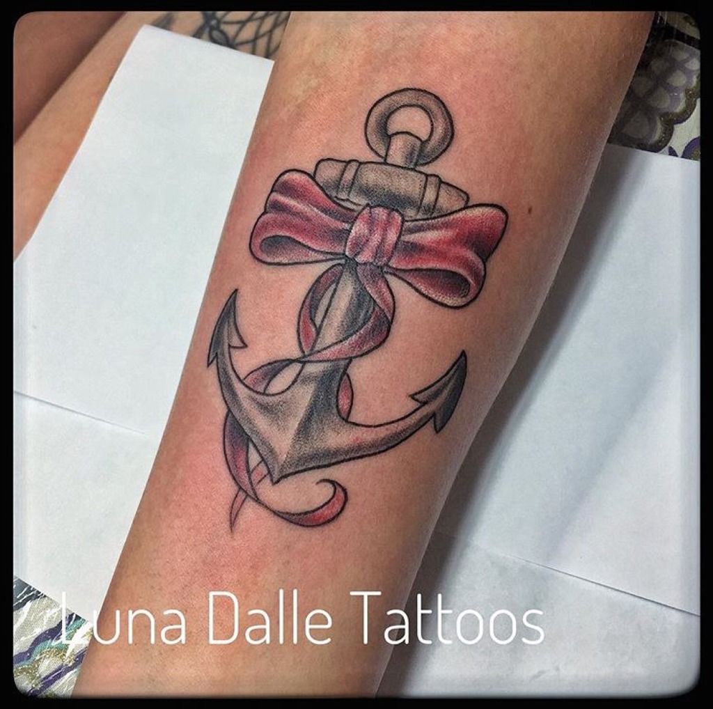Very feminine tattoo of an anchor and protea flowers and the verse: God is  within her, she will not fall. tattoo idea | TattoosAI