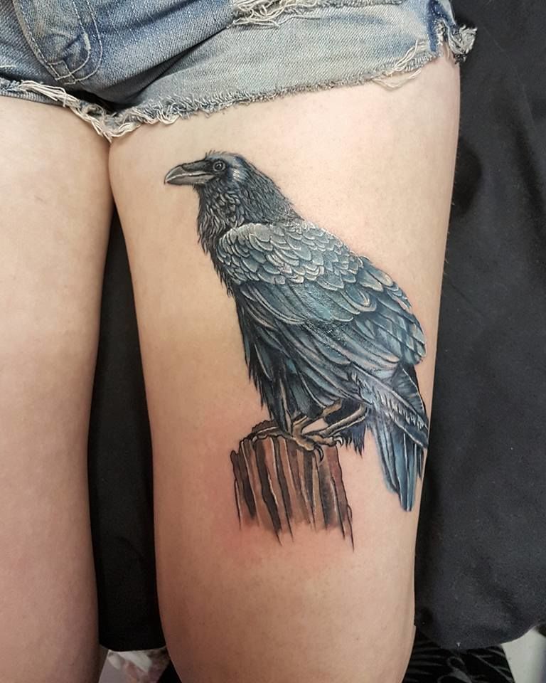 Realistic pied raven tattoo for that pretty girl