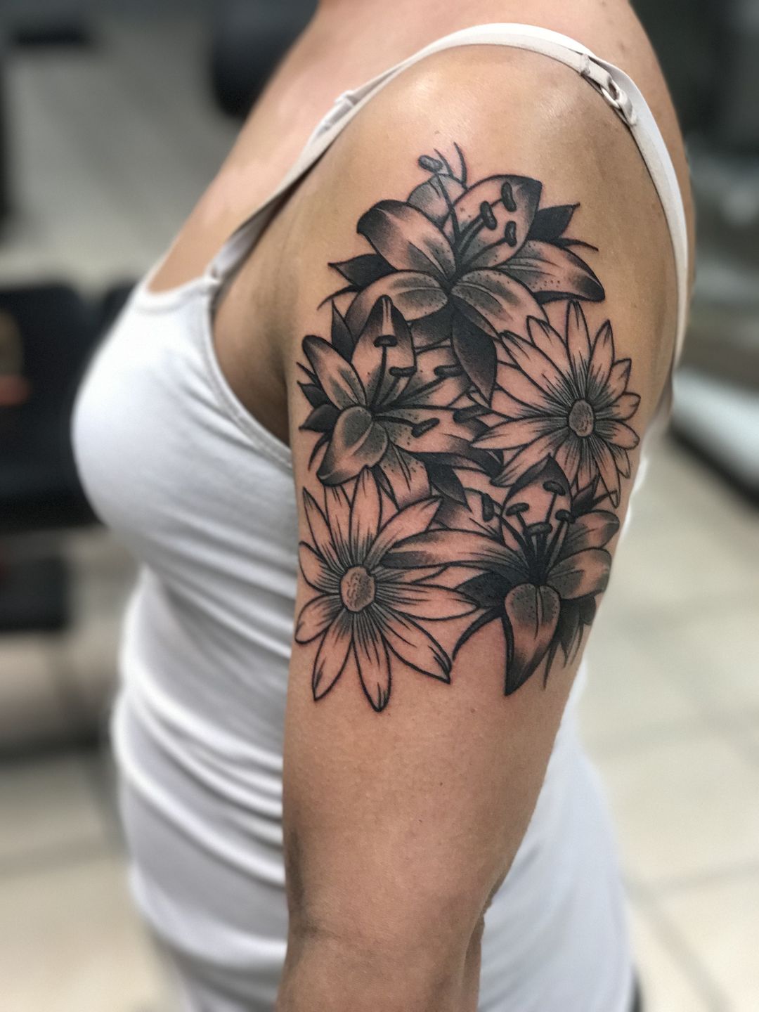 ronak:floral-flowertattoo-floral-lily-tattoo-daisytattoo-black-and-grey -sleeve-tattoo-tattoo-sleeve