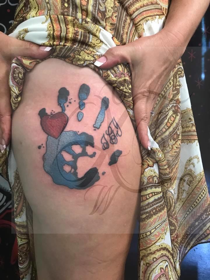 Hand_and_dog_print_tattoo