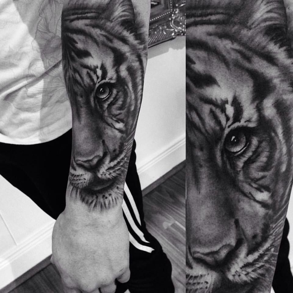 Great tiger tattoo by Iron Age Tattoo | Black and grey tattoos, Grey tattoo,  Tiger tattoo thigh