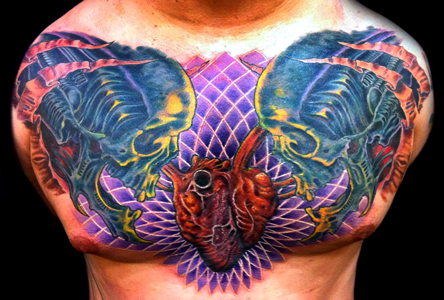 Las-vegas-tattoo-artist_joe-riley_biomech-skulls-chest-tattoo