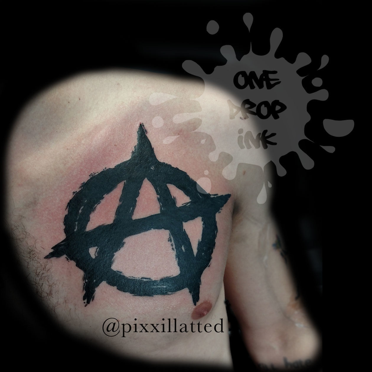 Anarchy sign tattoo in stone with pieces falling apart on men chest tattoo  idea | TattoosAI