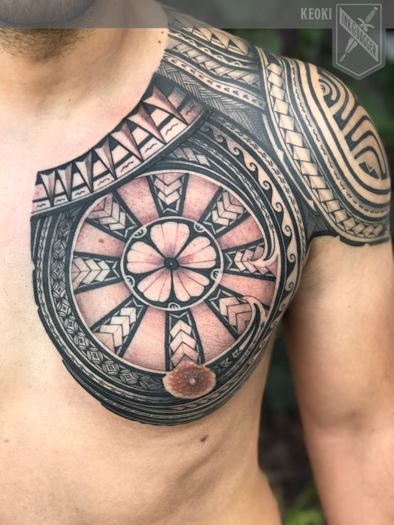 Polynesian style full sleeve and chest tattoo.