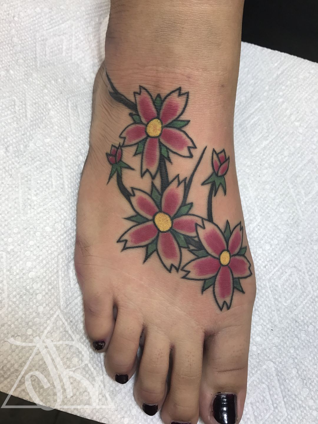 FYeahTattoos.com — A rose and a daffodil on my left foot; my mom's...