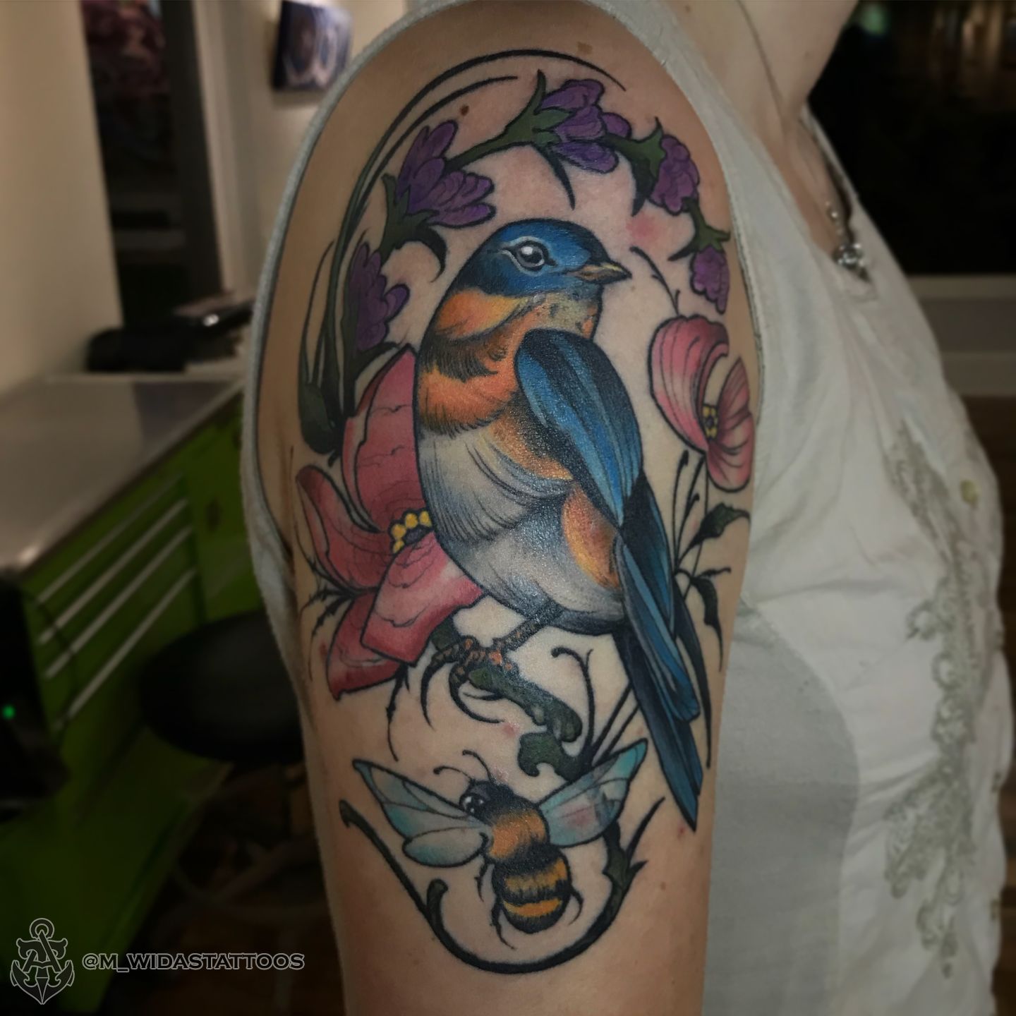 Little Tattoos — Watercolor style surrealist blue bird holding a...