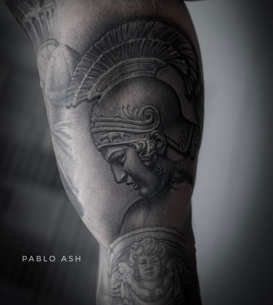 Black and grey Achilles portrait tattoo on the shoulder