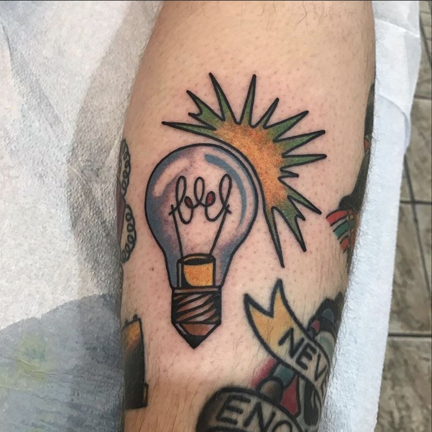 Single needle elephant light bulb tattoo on the inner