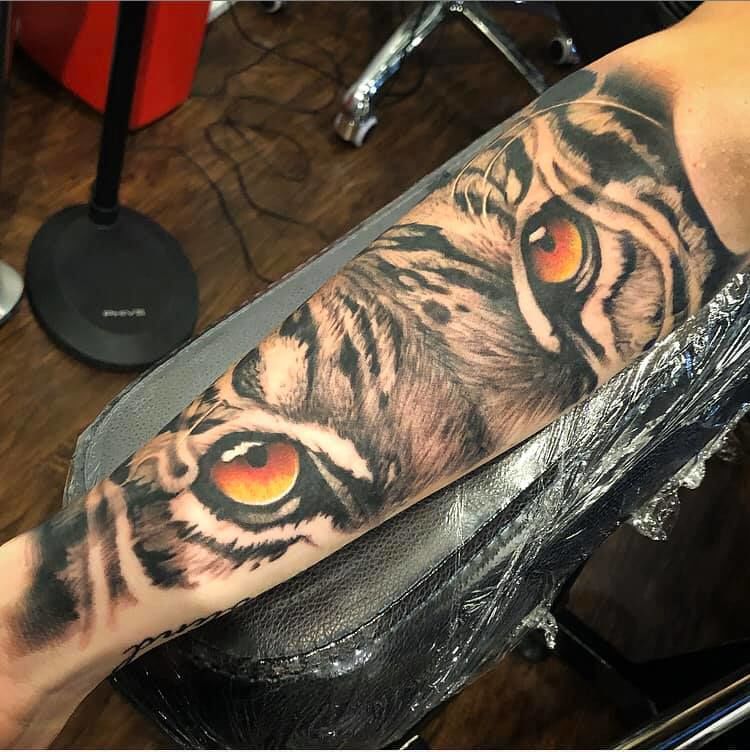 N.A Tattoo Studio - Tiger Eyes Armband Tattoo 💥DM US TODAY FOR YOUR FREE  CONSULTATION💥 =================== By Artist @nik_ink___ For Free  Consultations and Appointments ☎ +91 8800878580 📲 what app +918800878580  Newdelhitattoo@gmail.com ——————————