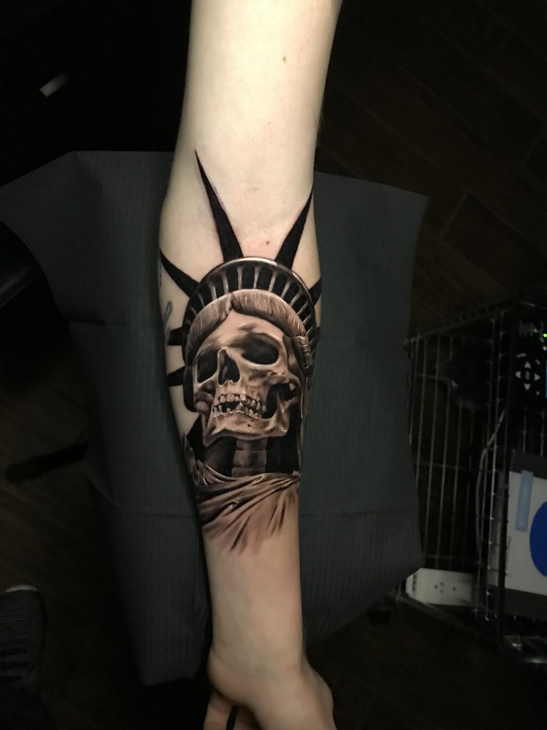 Grey Ink Skull With American Flag Tattoo
