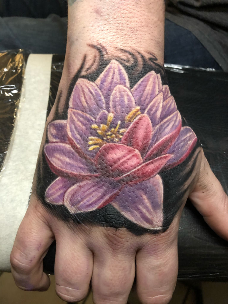 Japanese Lotus Flower Tattoo On Left Hand
