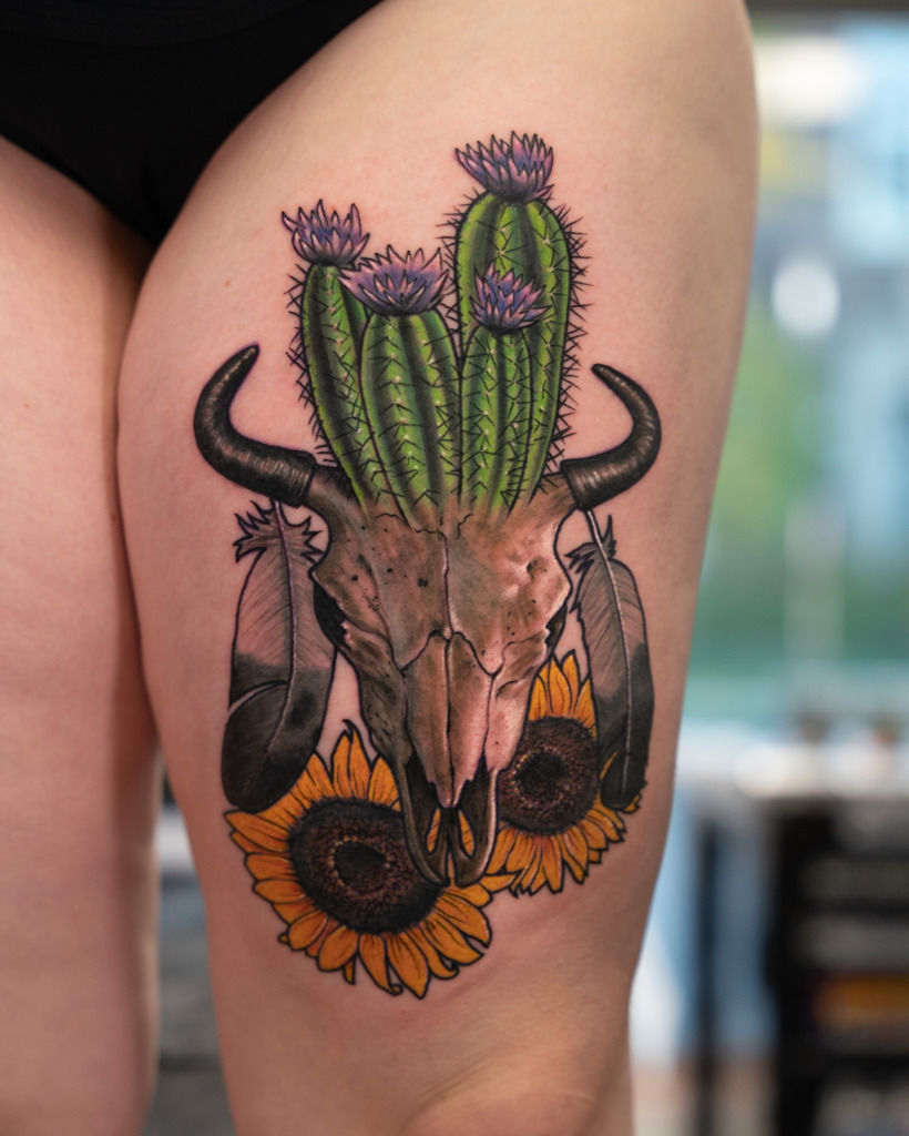 Microrealistic charging bull tattoo on the inner arm