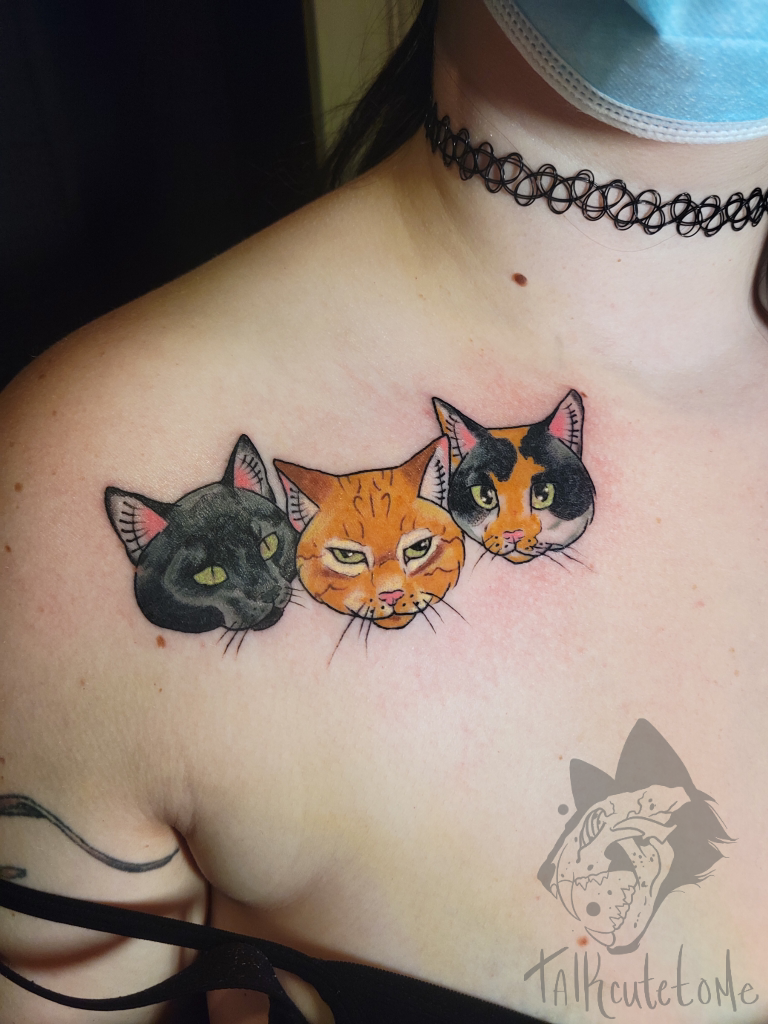 Neotraditional cats portrait tattoo on the thigh.
