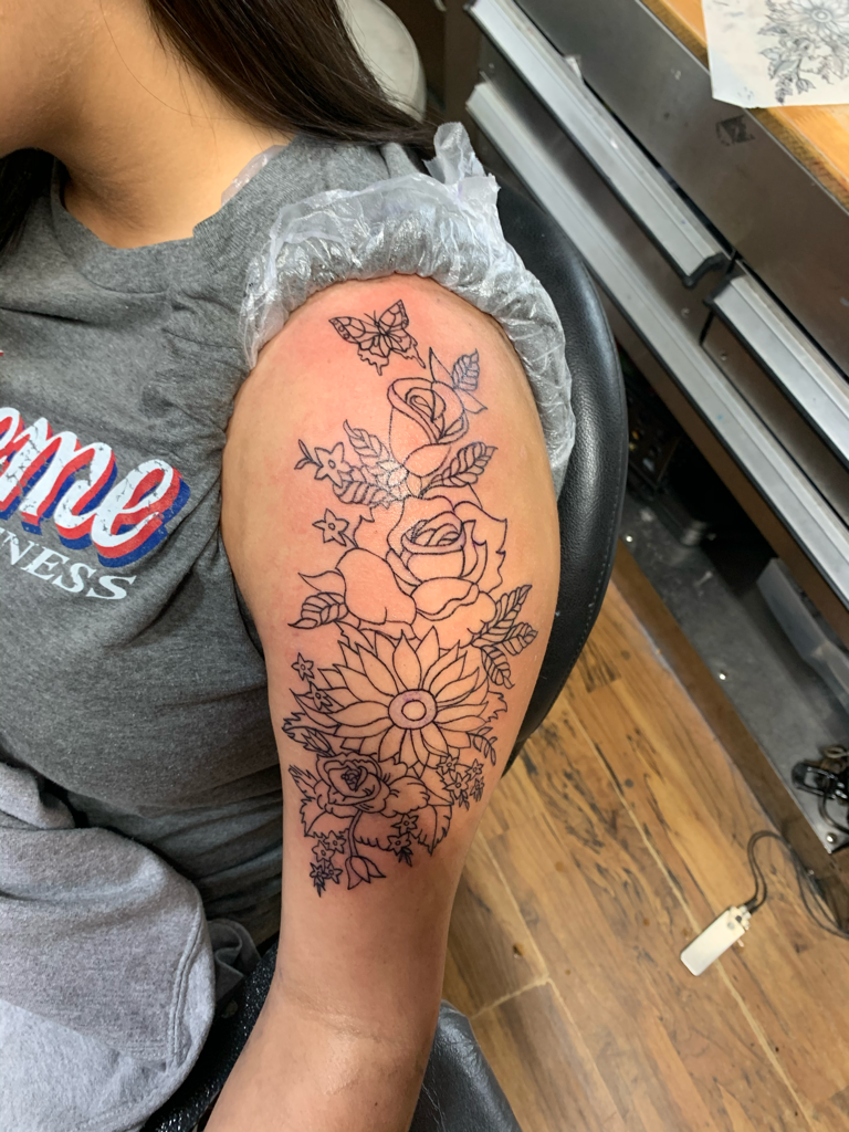 Sioux Falls Tattoo Floral Tattoo On The Clavicle With Black Line Work And  Shading – Starry Eyed Tattoos and Body Art Studio