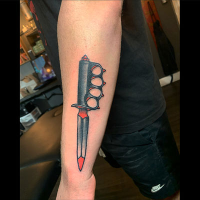 What does a tattooed dagger with two hands on the blade symbolize  Quora