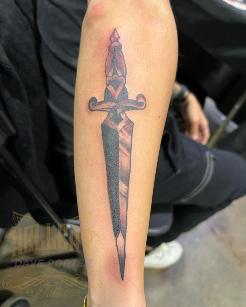 Tattoo uploaded by Benjamin • Traditional black large dagger design on  outside of forearm. • Tattoodo
