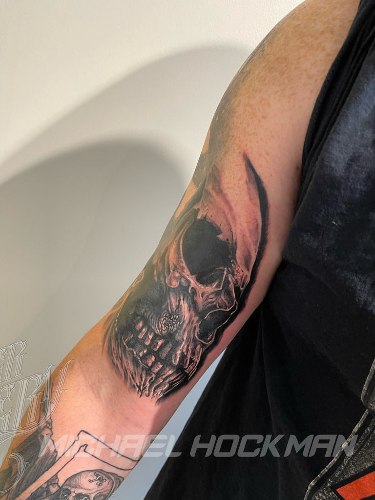 Tattooed hand of a woman in a black watch is holding a realistic model of a  human skull with teeth isolated on white. Medical science or Halloween hor  Stock Photo - Alamy